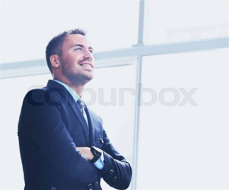 Happy joyful businessman looking to the future, stock photo