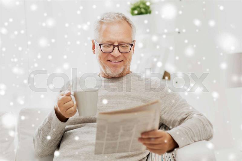Leisure, information, people and mass media concept - senior man in glasses reading newspaper at home over snow, stock photo