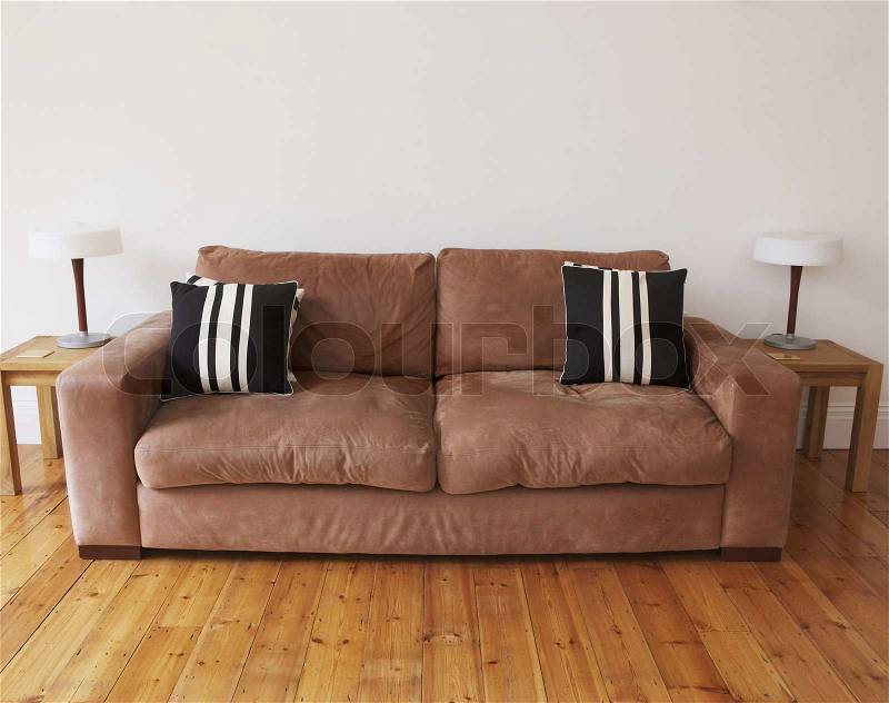 Empty living room with couch and end tables, stock photo