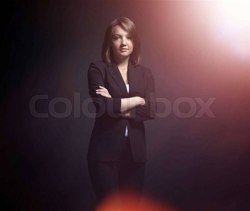 Full-length portrait of businesswoman isolated on black backgro, stock photo