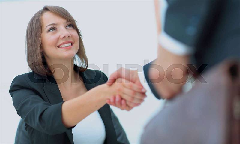 An attractive woman and man business team shaking hands at offic, stock photo