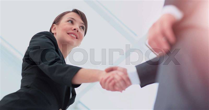 Two professional business people shaking hands, stock photo