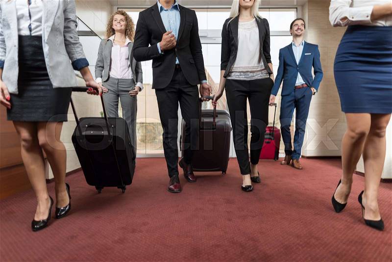 Business People In Hotel Lobby, Mix Race Businesspeople Group Guests Arrive Entrance With Suitcase, stock photo