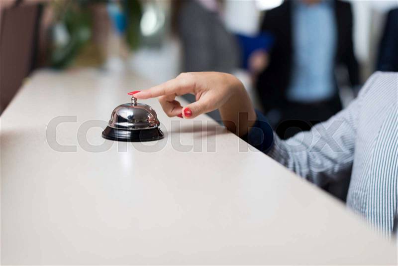 Business Woman Hand Press Bell Modern Luxury Hotel Reception Counter Regstration Workplace, stock photo