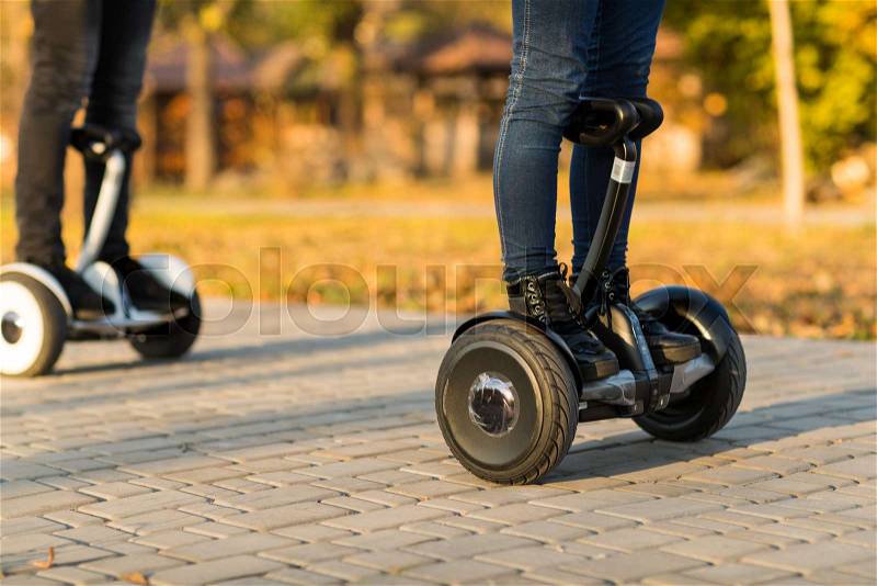 Male legs on electrical scooter outdoors gyroscooter personal transport, stock photo