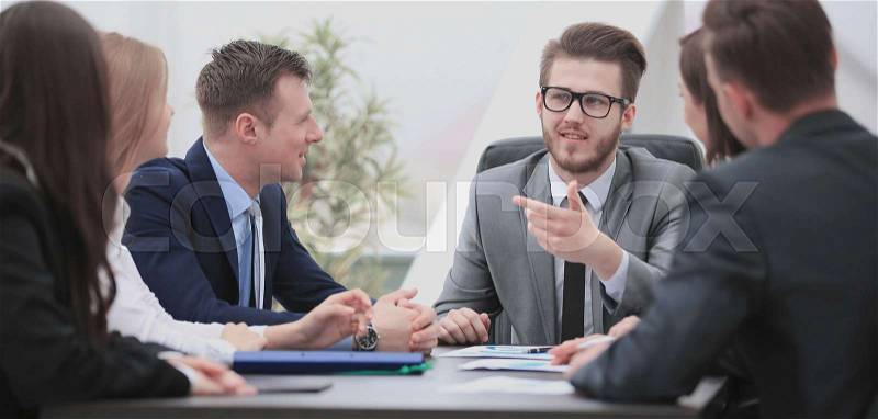 Group of young business people gathered together discussing crea, stock photo