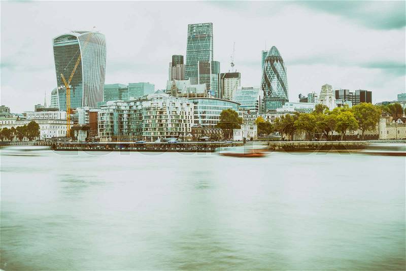 LONDON - SEPTEMBER 25, 2016: Modern city skyline along Thames river. London attracts 30 million tourists annually, stock photo