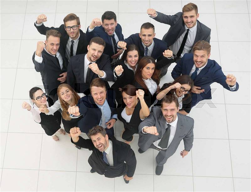 View from the top.professional business team shows its success.isolated on white background, stock photo