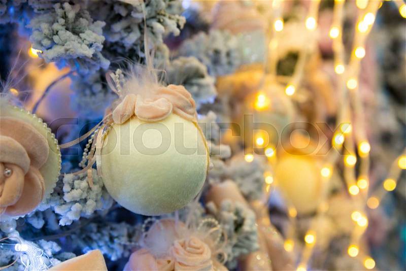 Christmas tree decorated with soft balls and lights, garland closeup. Xmas decor, new year. Winter holiday celebration, stock photo