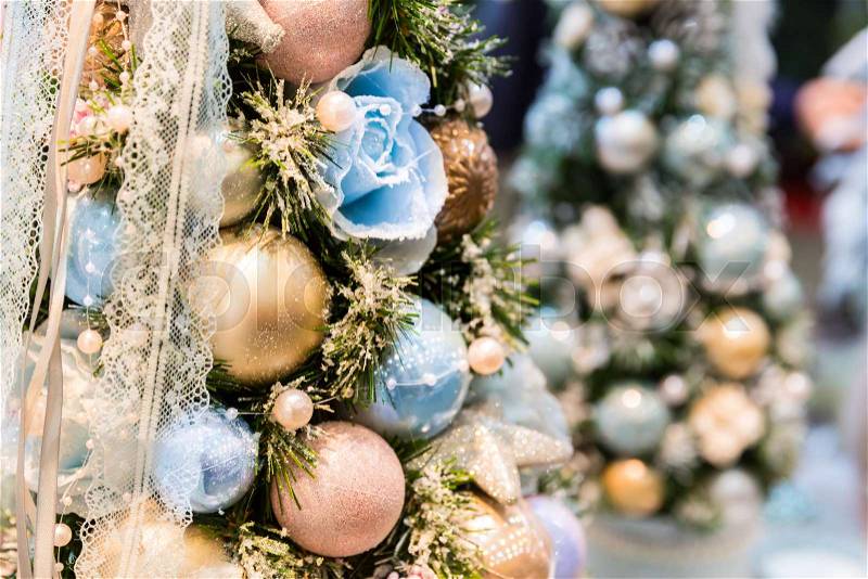 Christmas tree decorated with blue and gold balls closeup. Xmas decor, new year. Winter holiday celebration, stock photo