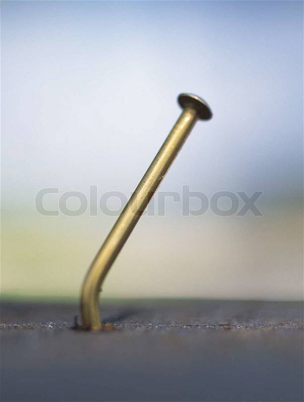 Nail in wood, stock photo