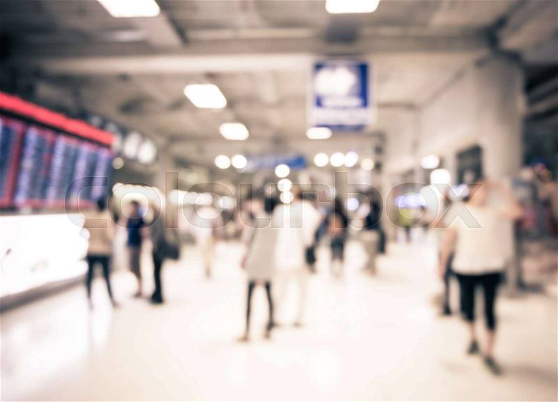 Blur background : People at departure and arrivals electronic schedule board in airport, stock photo