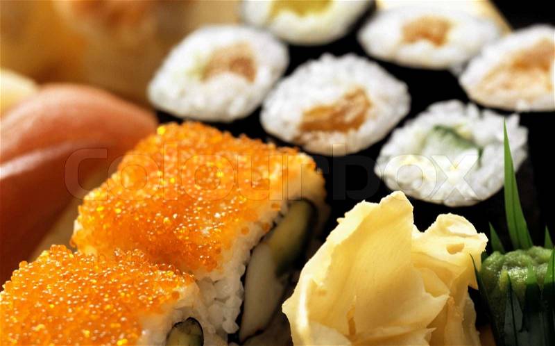 Sushi rolls on a traditional oriental sectioned dish, stock photo