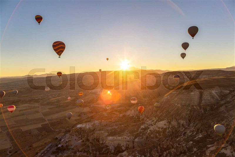Hot air Balloons flight in Cappadocia, Nevsehir, Turkey in a beautiful summer day, stock photo