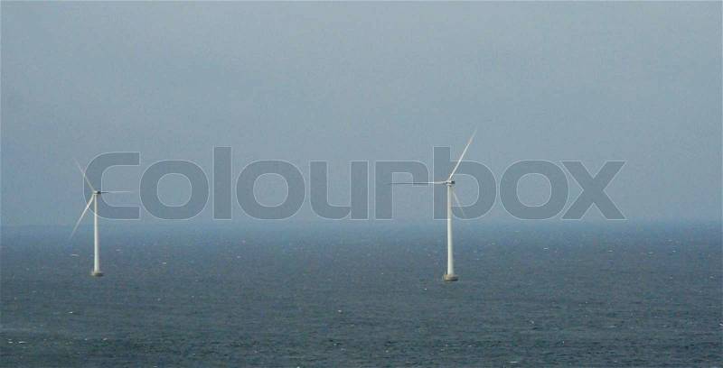 Wind Turbines at Sea - Using the Ocean's Power, stock photo