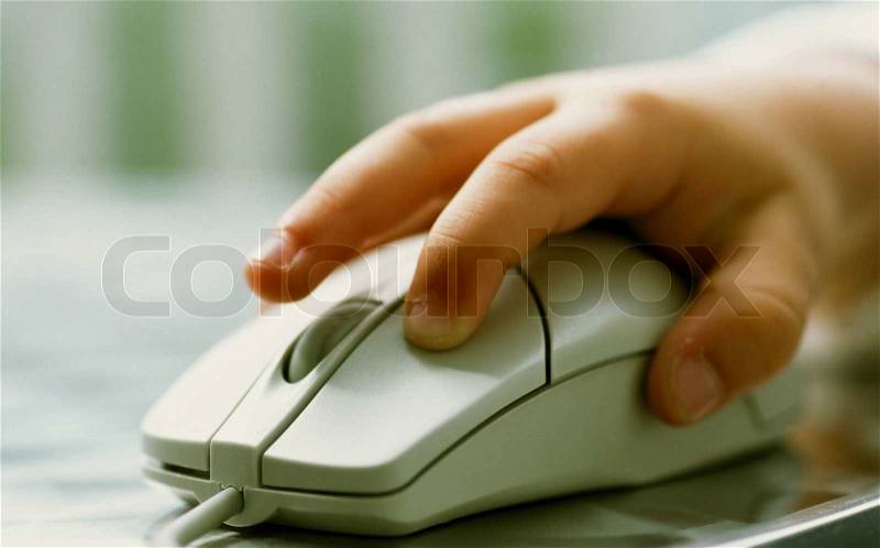 Child operating mouse close up and isolated, stock photo