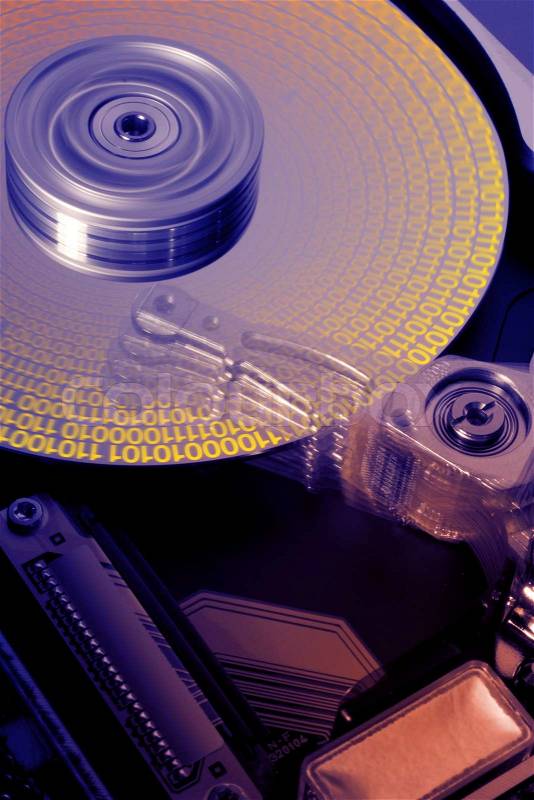 Studio photography of a opened hard disk at work with symbolic data while processing, stock photo