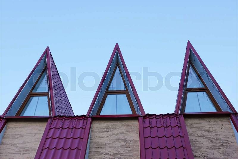 Detail of the roof covered with metal tile in evening light, stock photo