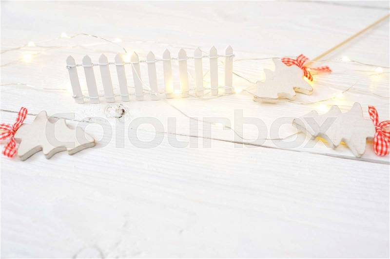 Christmas mock-up or greeting card on white wooden background in rustic style, stock photo