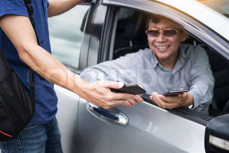 Tourists or traveler seek advice map with smart phone from taxi drivers, stock photo
