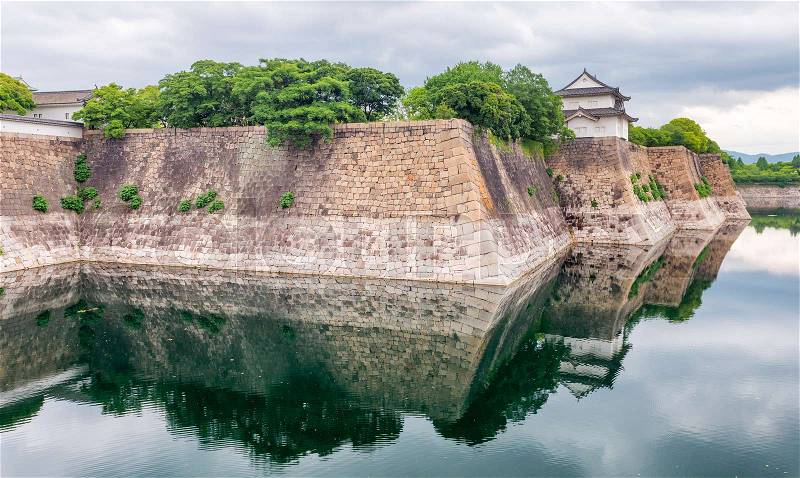 Osaka Castle Walls surrounded by water, stock photo