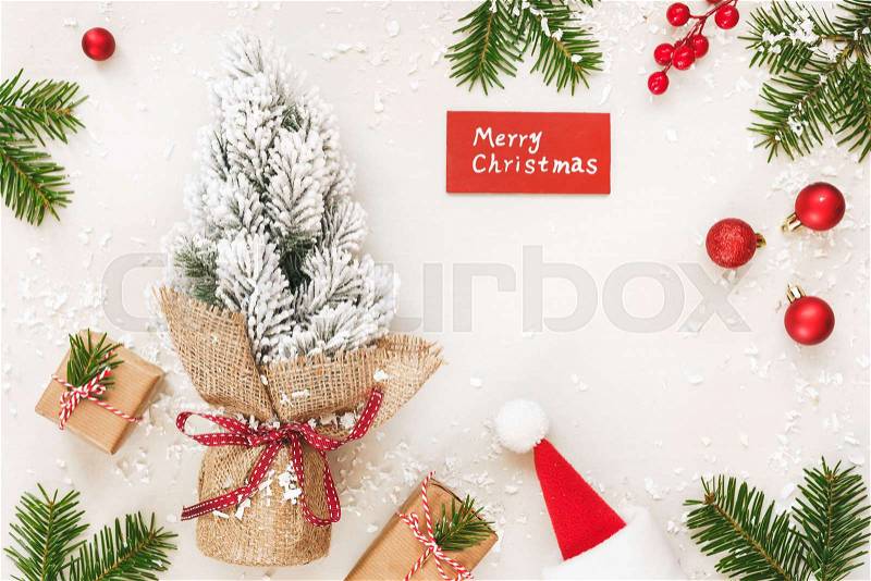 Christmas frame of gifts and Merry Christmas sign on white. Top view, blank space, stock photo