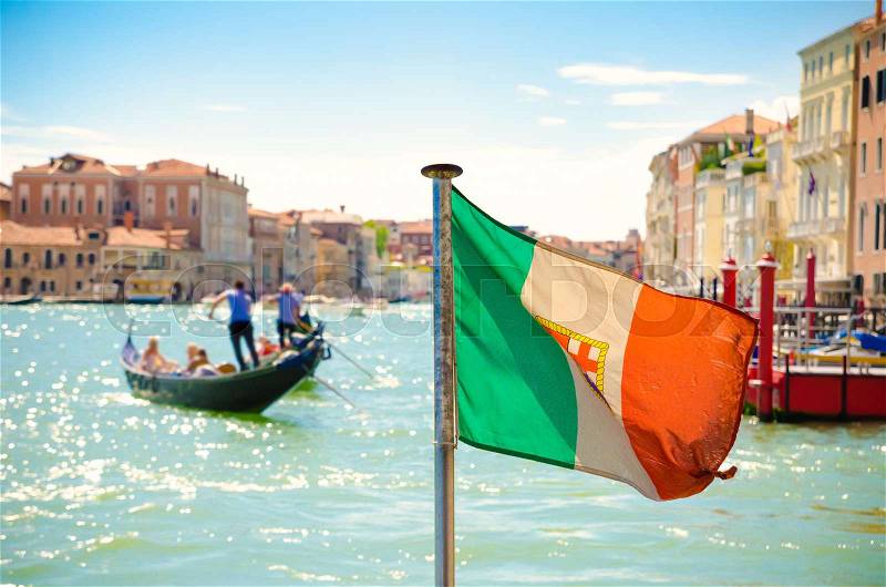 Italian flag on grand canal in Venice, stock photo
