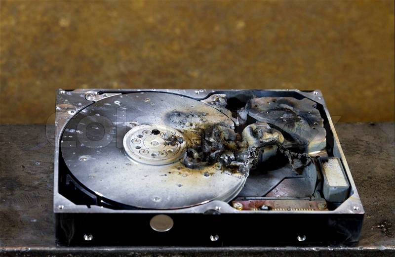 Detail shot of a massive destroyed hard disk drive, stock photo