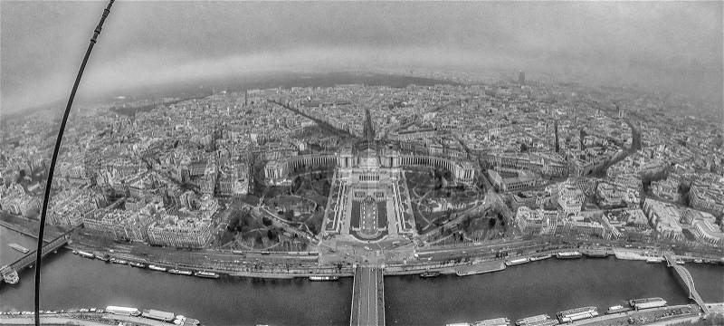 Wide angle view of Paris skyline and Seine river from Eiffel Tower on a cloudy winter day - France, stock photo
