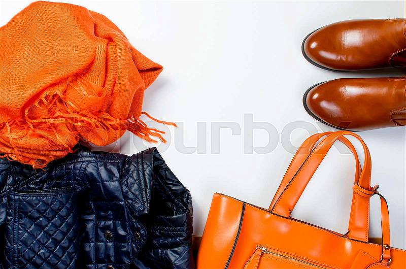 Collage of Feminine clothing and accessories. jacket, boots, scarf, bag for autumn day in yellow and orange color on white background. , stock photo
