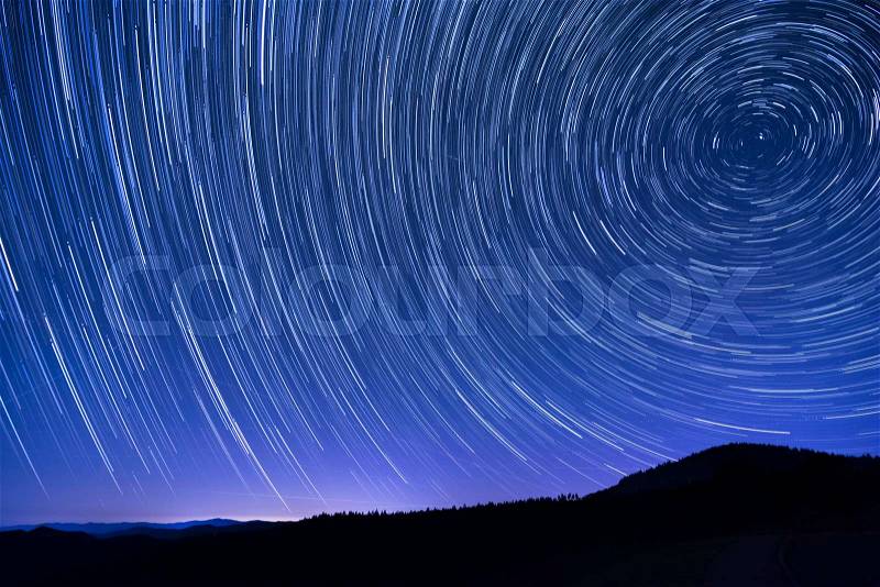 Star trails as seen from the Cowee Mountain Overlook on the Blue Ridge Parkway in western North Carolina, stock photo