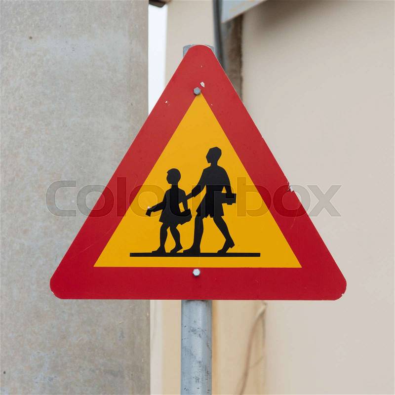 Iceland: warning sign of children crossing street from school, stock photo