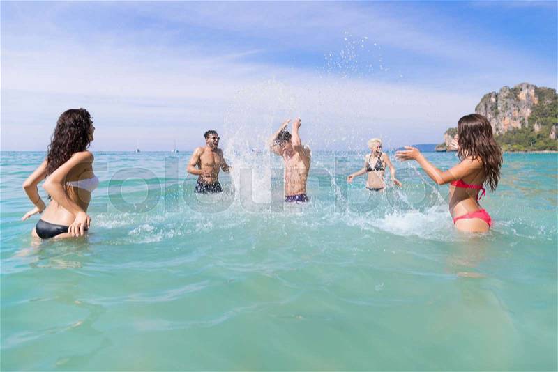 Young People Group On Beach Summer Vacation, Happy Smiling Friends In Water Sea Ocean Holiday Travel, stock photo