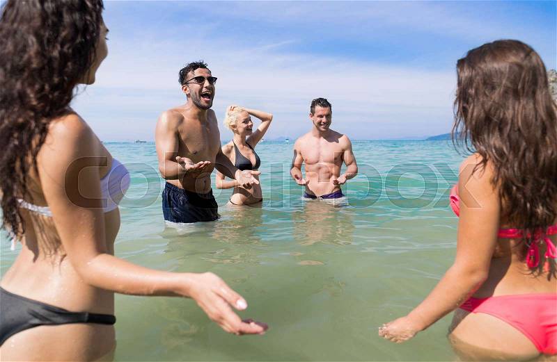 Young People Group On Beach Summer Vacation, Happy Smiling Friends In Water Sea Ocean Holiday Travel, stock photo