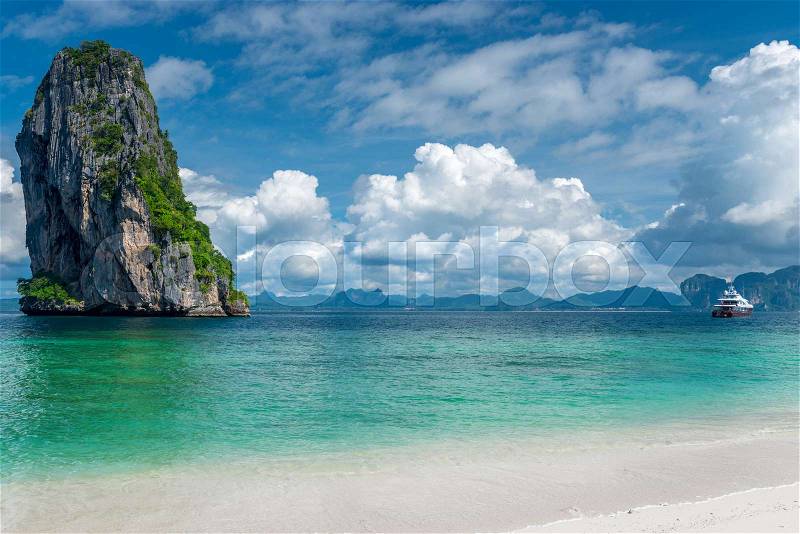 Postcard view - sea, cliff, yacht - Poda island, Thailand, stock photo