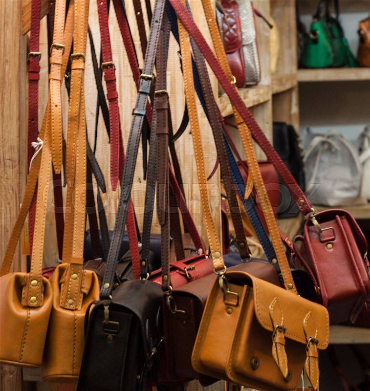 Brown leather backpack hanging on the wall. fashion item sell shopping photo, stock photo