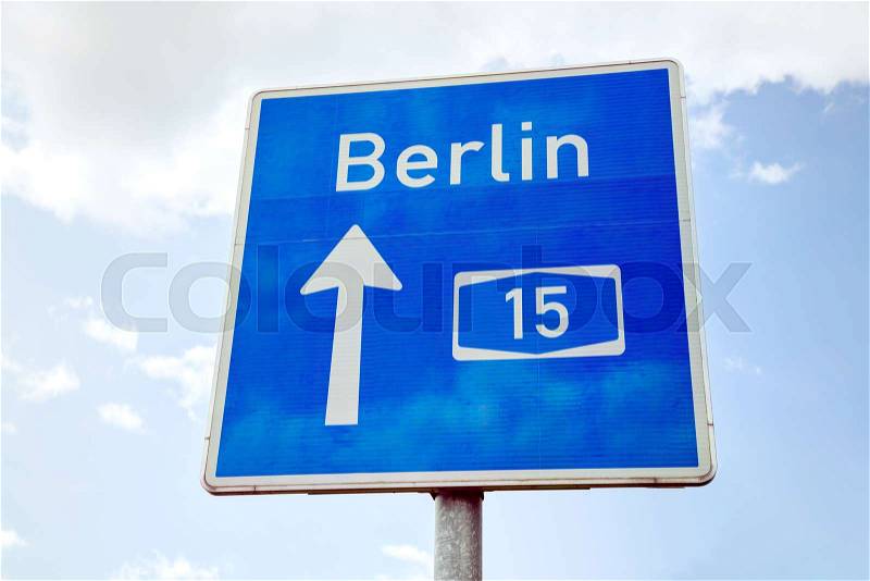 Traffic sign with direction to Berlin, Germany, stock photo