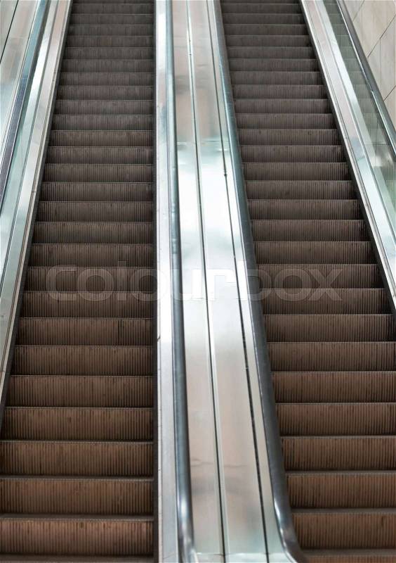 Electric escalator in metro. Moving staircase, stock photo