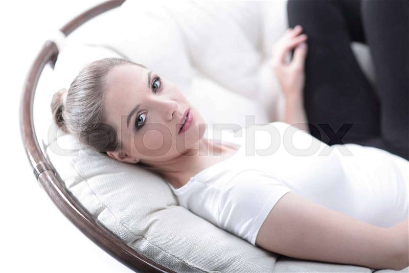 Tired woman resting in an easy chair made of rattan.photo with copy space, stock photo