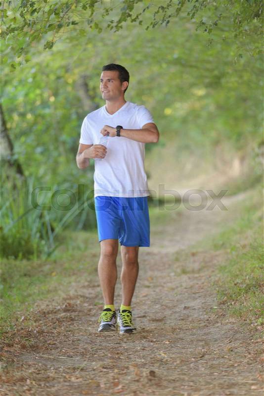 Man exercising wearing fitness watch, stock photo
