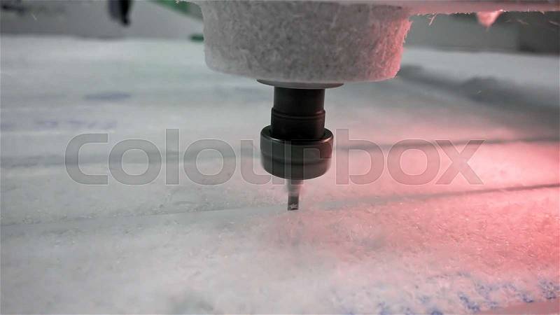Milling cutter cuts plastic part on robotized production line. Factory robots used to produce precise an strict product on automation conveyor lines, stock photo