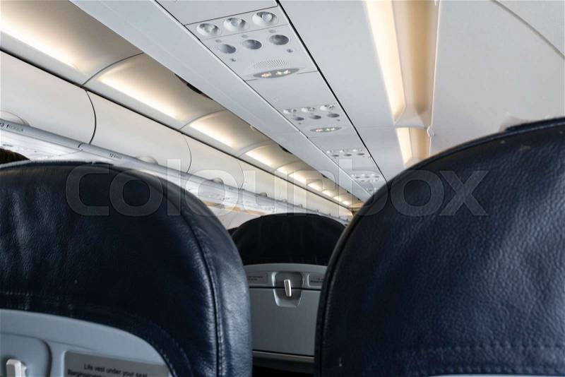 Armchairs inside a passenger plane, stock photo