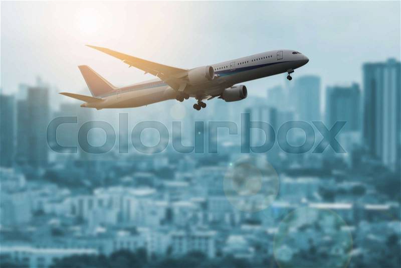 The plane was flying over the city, stock photo