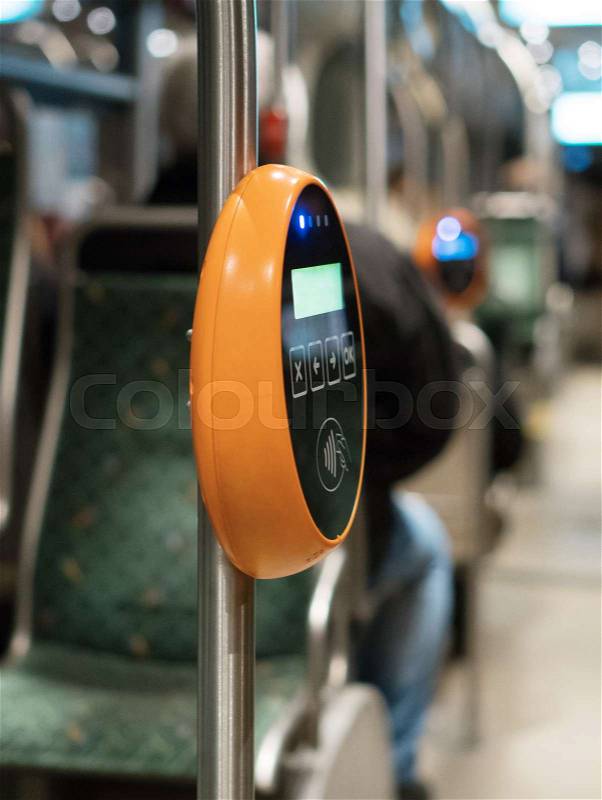 Ticket validation system on modern public transport, stock photo