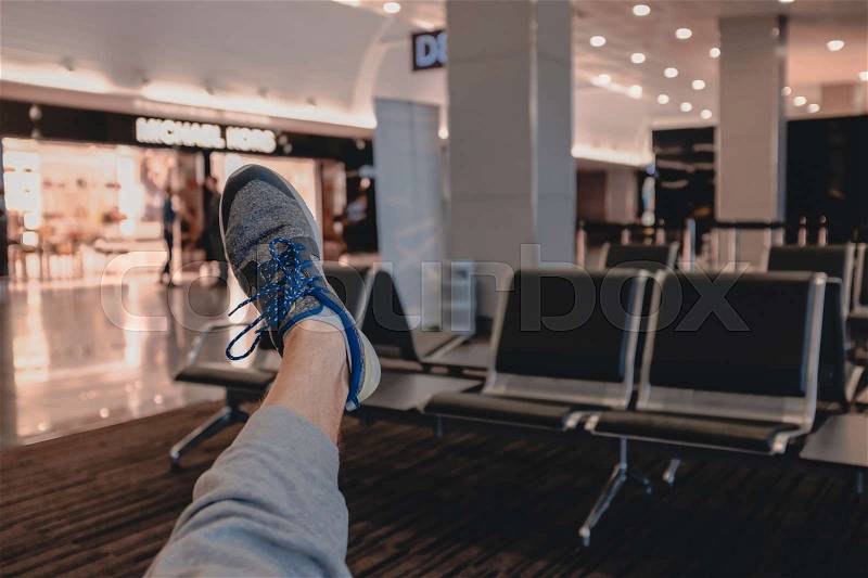 One leg in airport in waiting hall, stock photo