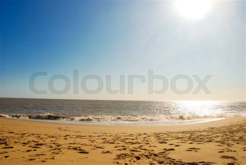 Beautiful seascape with sun, sky, ocean and sand, stock photo