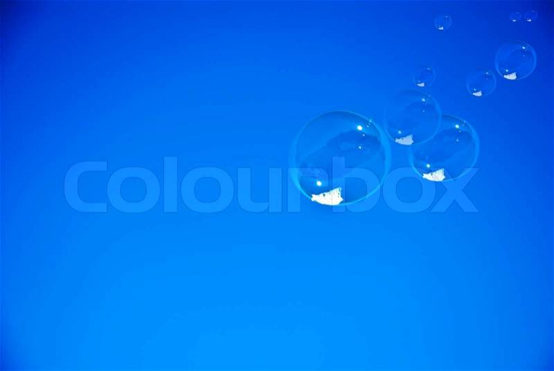Soap bubbles against the blue sky, stock photo