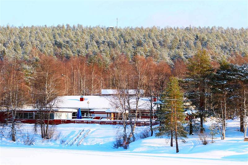 Cottage house in forest in winter Rovaniemi, Lapland, Finland, stock photo