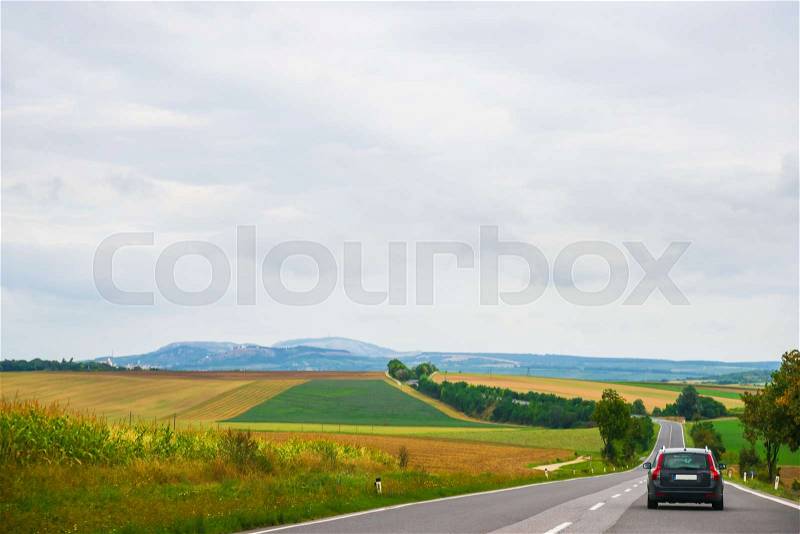 Landscape and car on road in South Moravia, Czech Republic, stock photo
