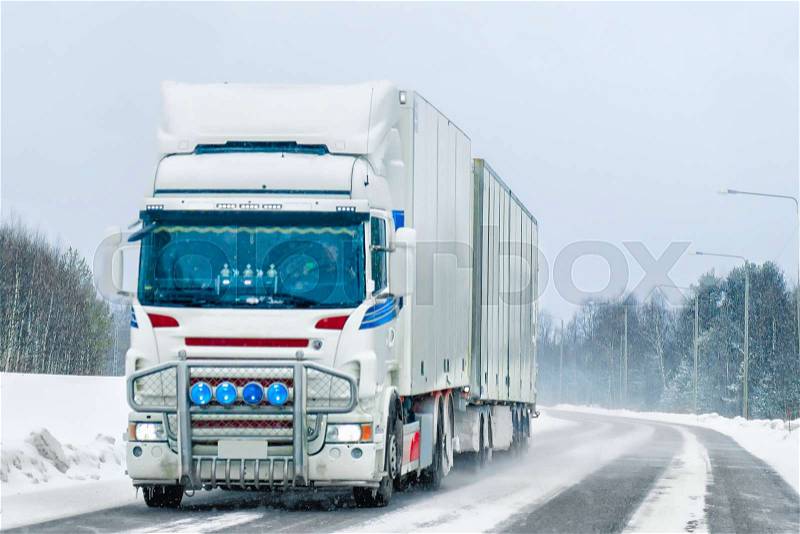 Truck at the road of winter Rovaniemi, Lapland, Finland, stock photo